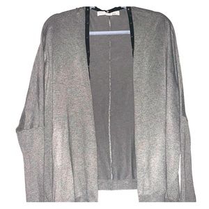 Grey sweather with faux leather and studs.